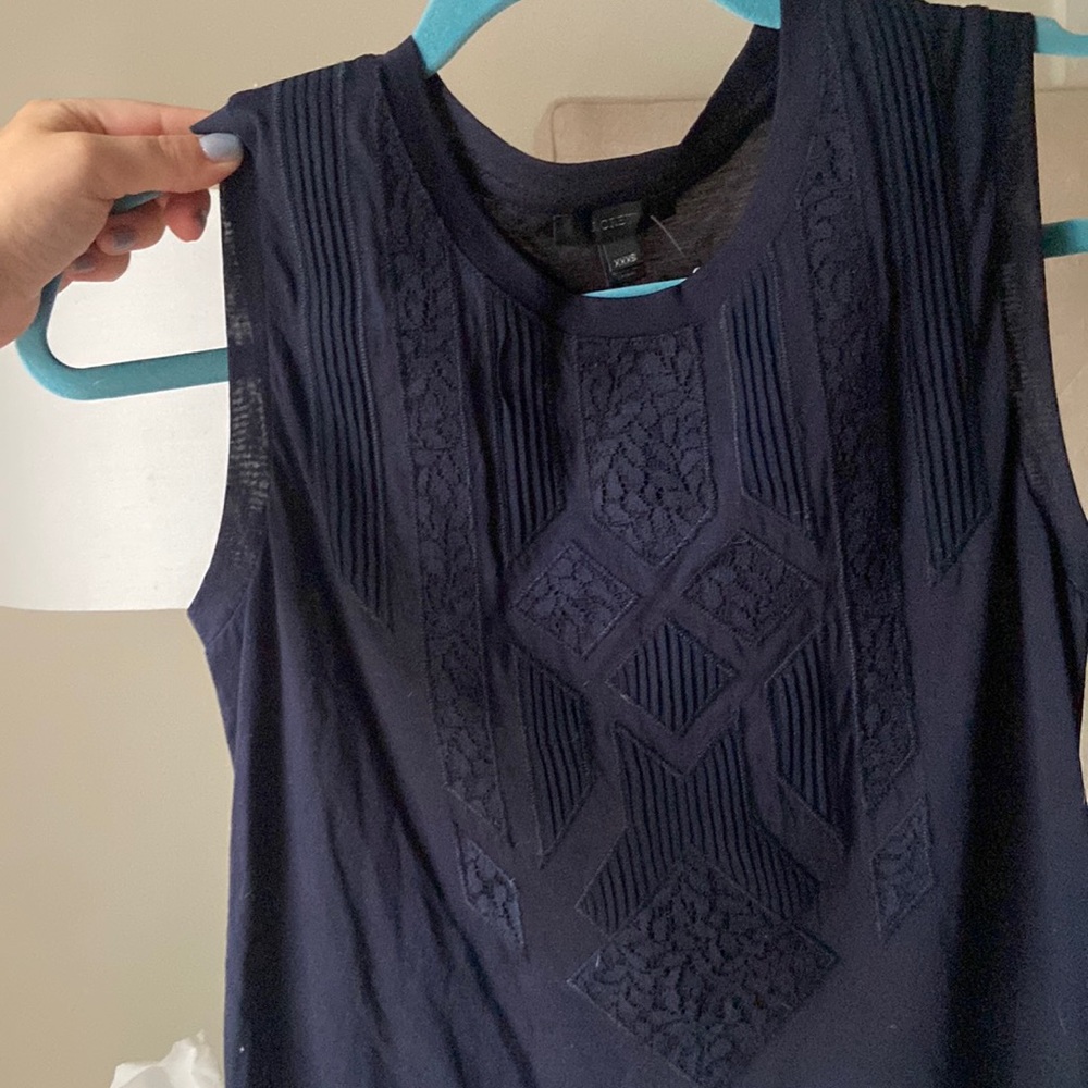 Navy J crew sleeveless shirt. New with tags never worn. Fits like an XS